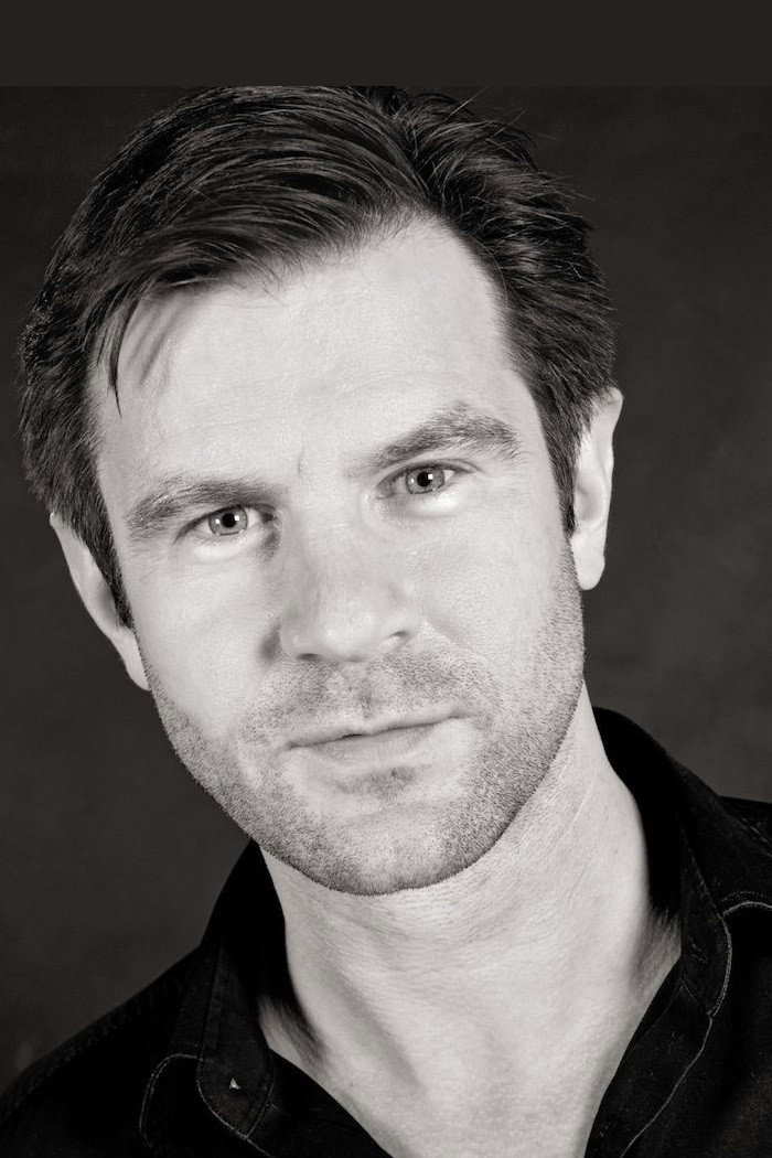 Stuart Laing as Robert Freeman in In a Land of Plenty
