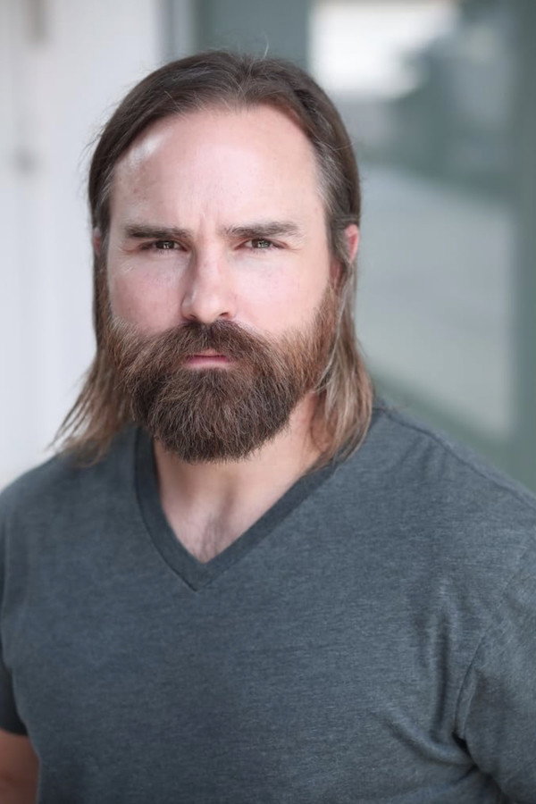 Zach Ball as Reverend Ron in Sheltered