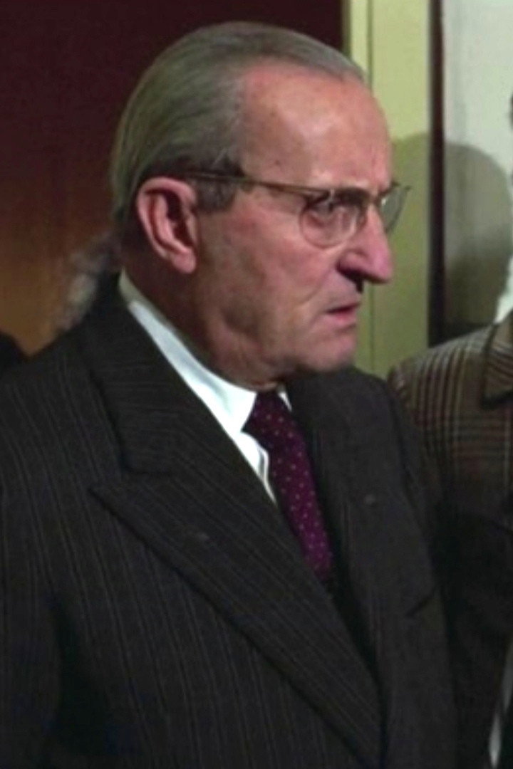 Enzo Mondino as Man holding his Seagram before the funeral (uncredited) in Yellow: The Cousins