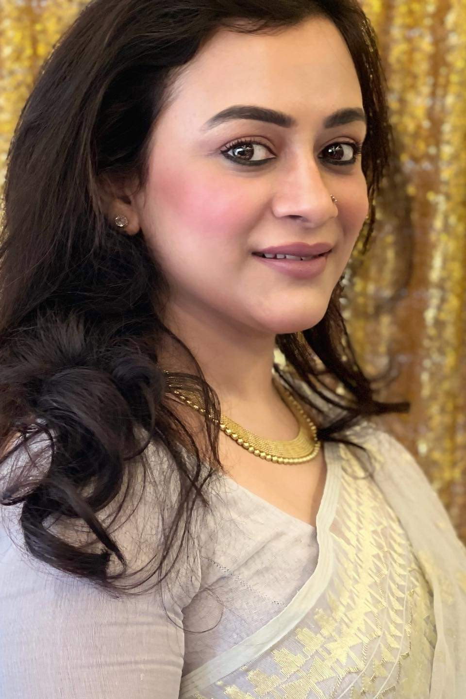 Mousumi Nag as Mita Rahman in Aatka