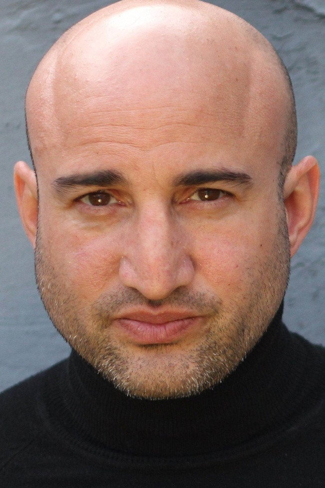Shashi Rami as Gang Member in Capital Letters
