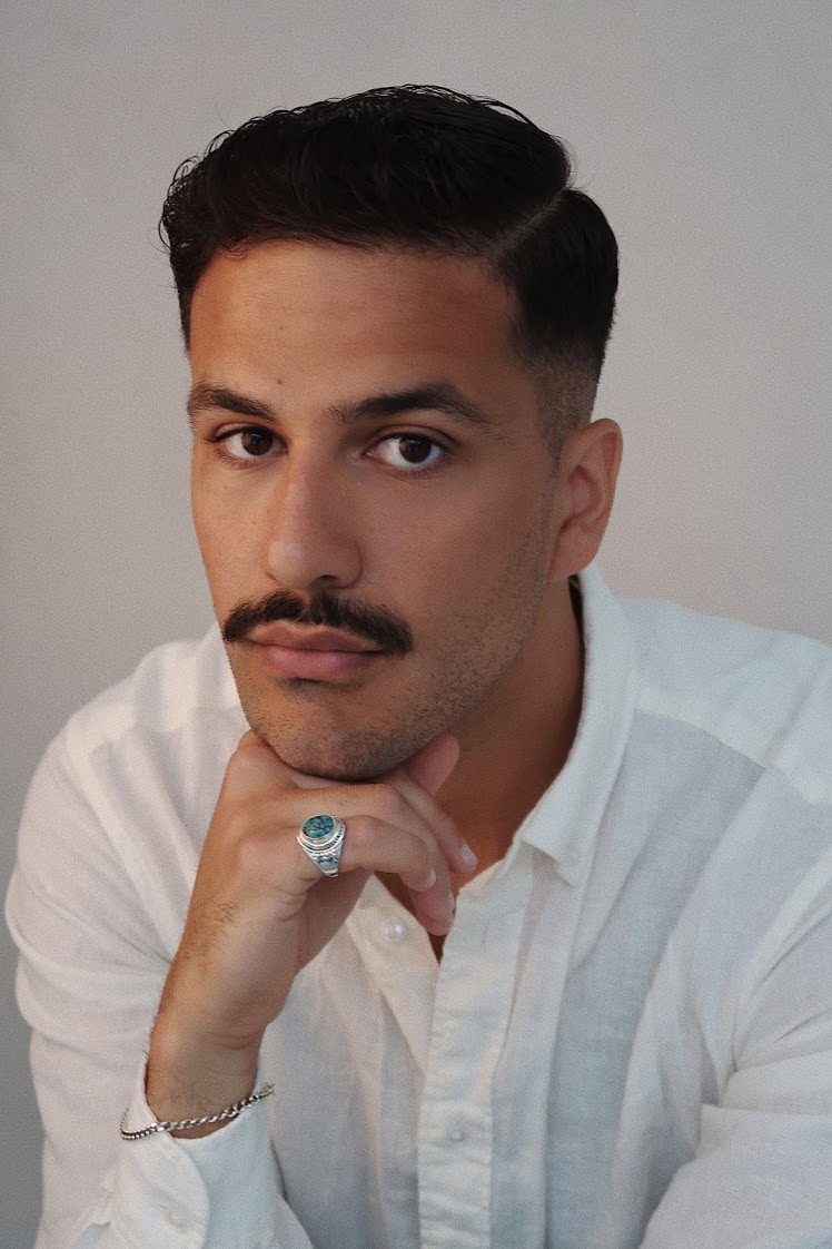 Mustafa Al-Mashhadani as Amir in A Part of You