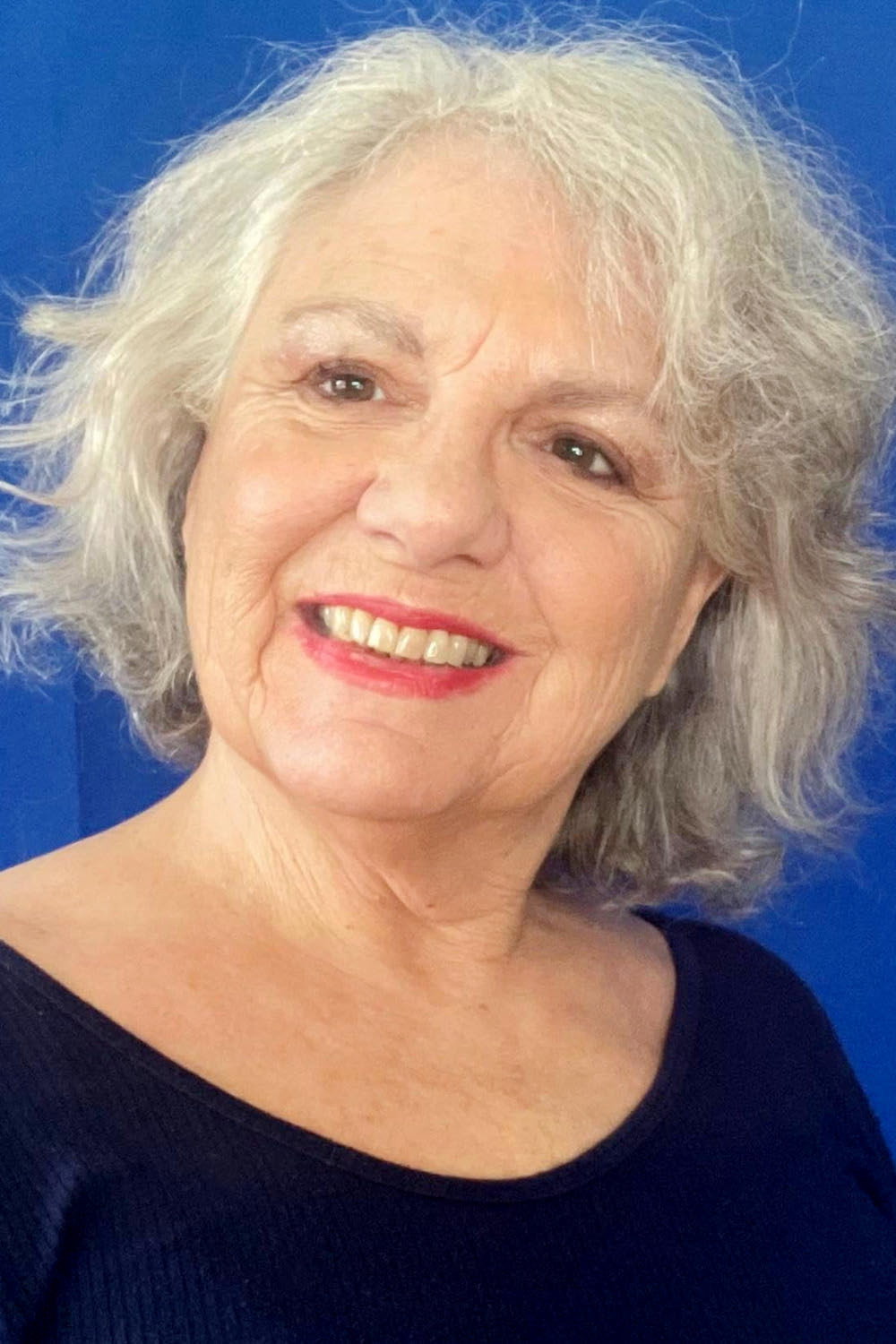 Elizabeth D'Onofrio as Miss Joan in Stepping into Love