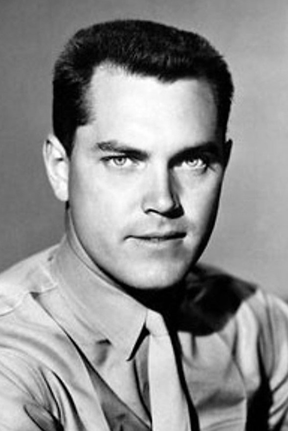 Jeffrey Hunter as Signalman Andrew 'Canada' Brown in Sailor of the King