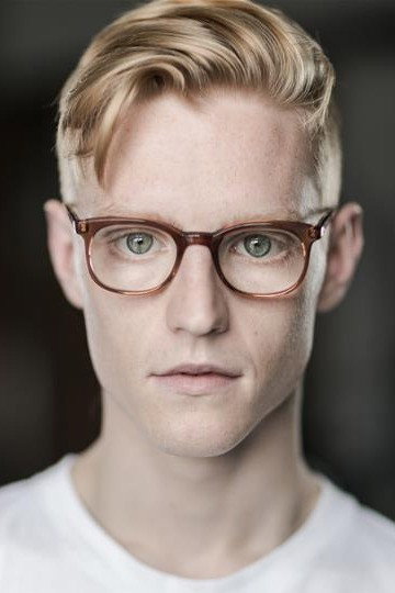 John McCrea as Artie in Cruella
