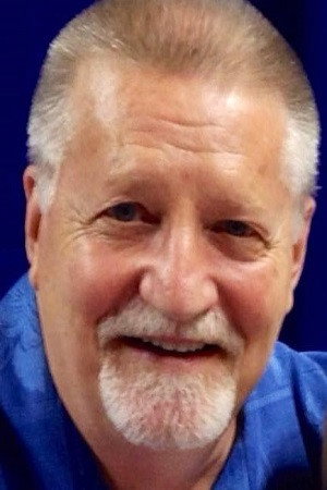 Larry Kenney as Bluegrass / Pokerface (voice) in SilverHawks