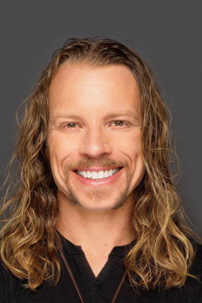 Dustin Leighton as Travis in Exit to Hell