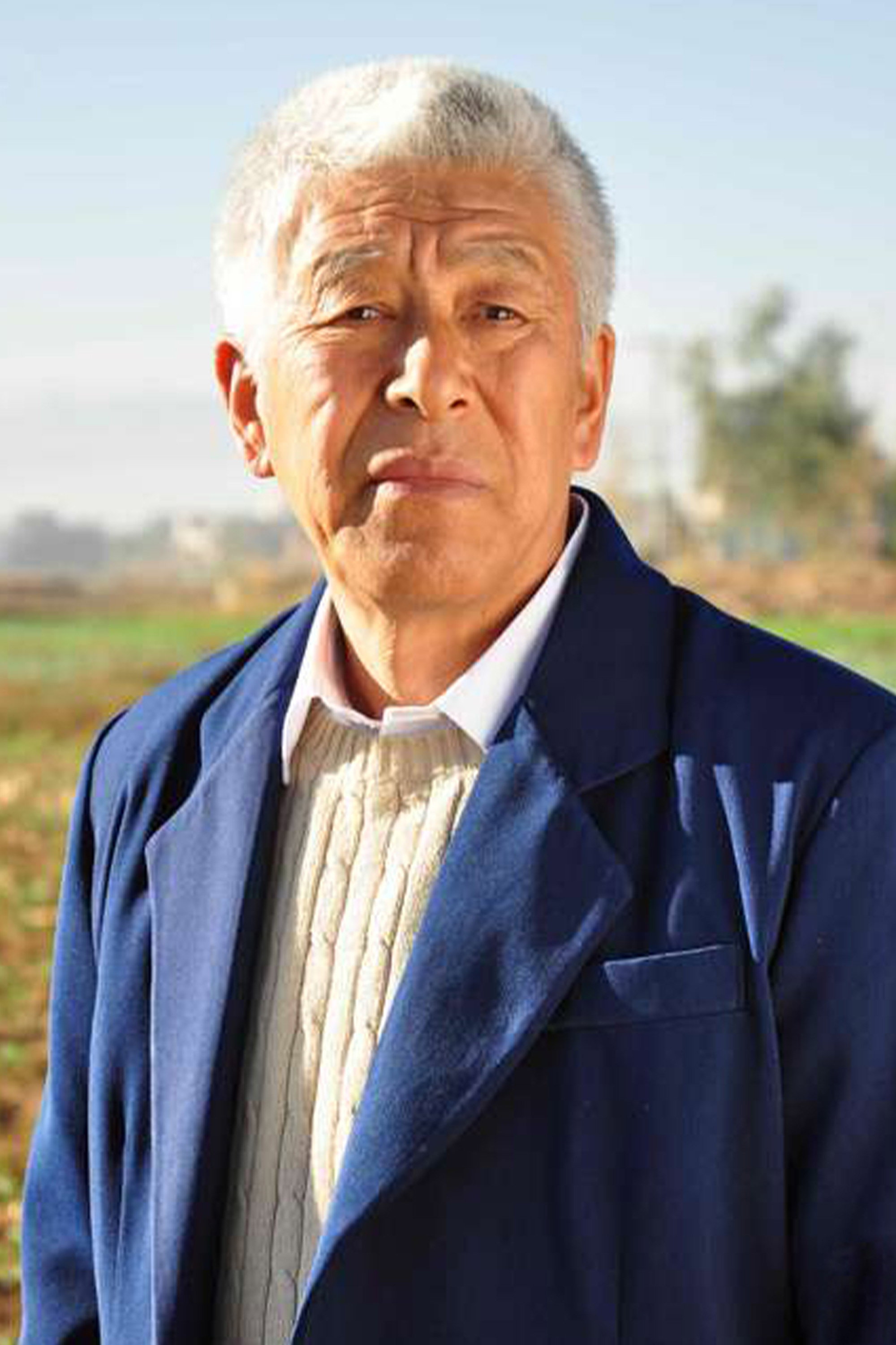 Zhang Hongjie as Pu Faxing in Village Official Pu Faxing