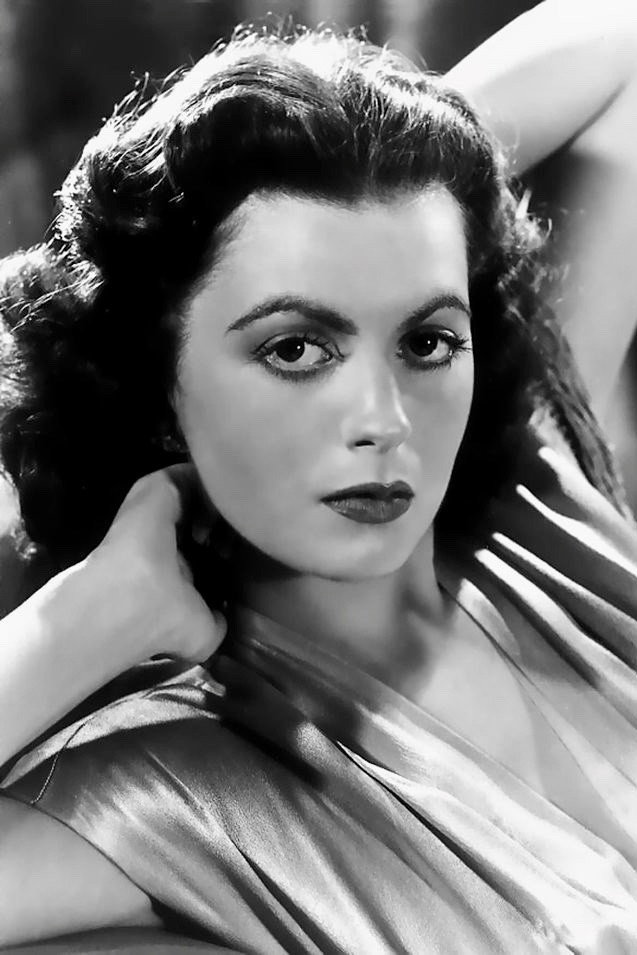 Faith Domergue as Dr. Marsha Evans, Vega in Voyage to the Prehistoric Planet