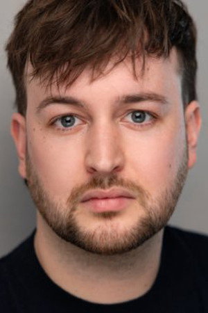 Ed Theakston as The Barman in The Renata Road