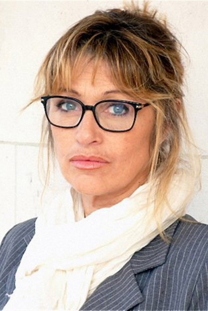 Valérie Gil as Colette Moivin, gendarme in Louis la Brocante
