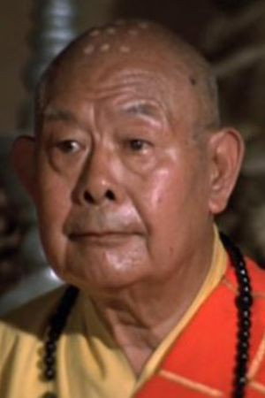 關仁 as Priest in Honor and Love