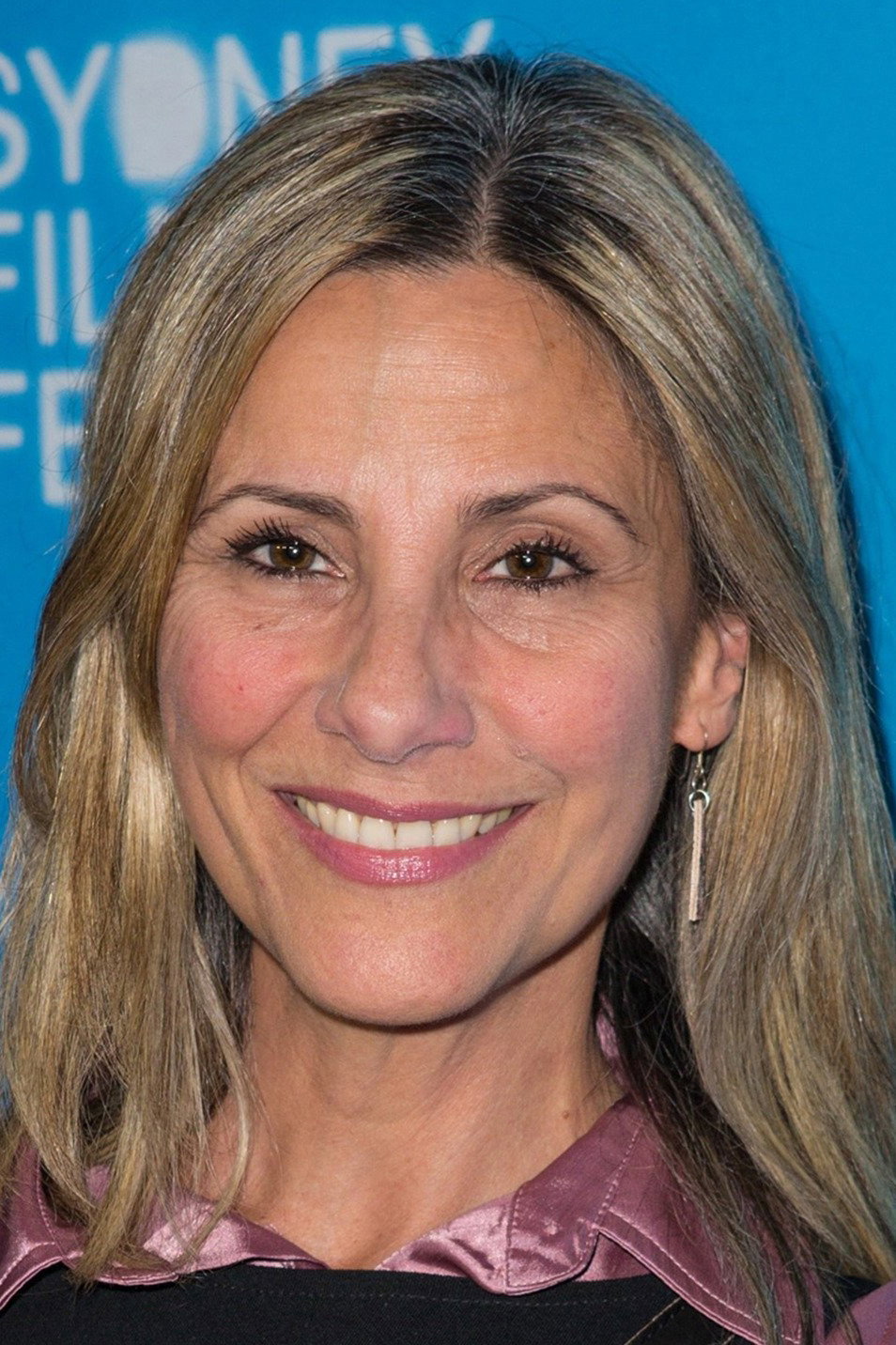 Zoe Carides as Leanne Ashbrook in Airlock