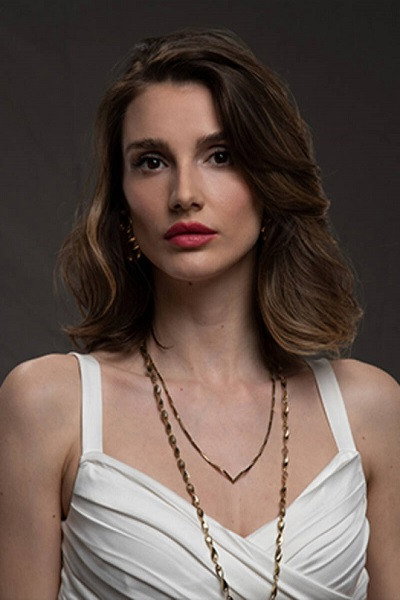 Aslı Sümen as Tuğçe Dikman in Twist of Fate
