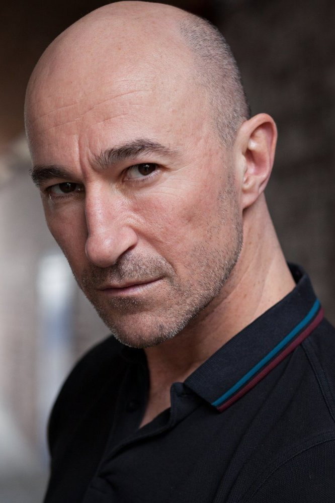 Ross Mullan as The Croupier in The Outer Darkness