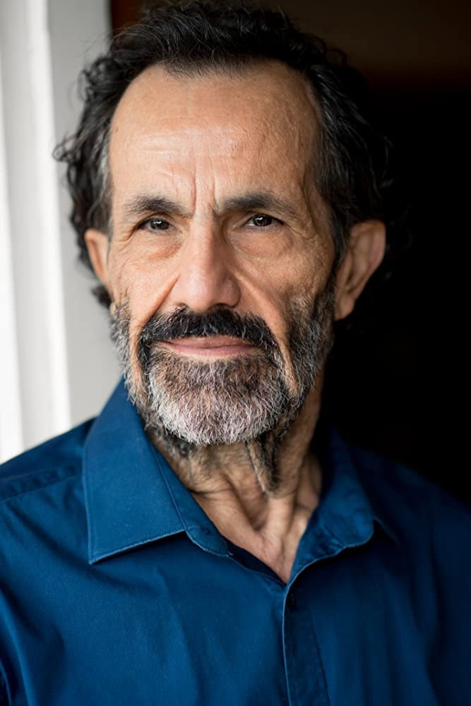 Simon Elrahi as Simon Elrahi in Streets of Colour