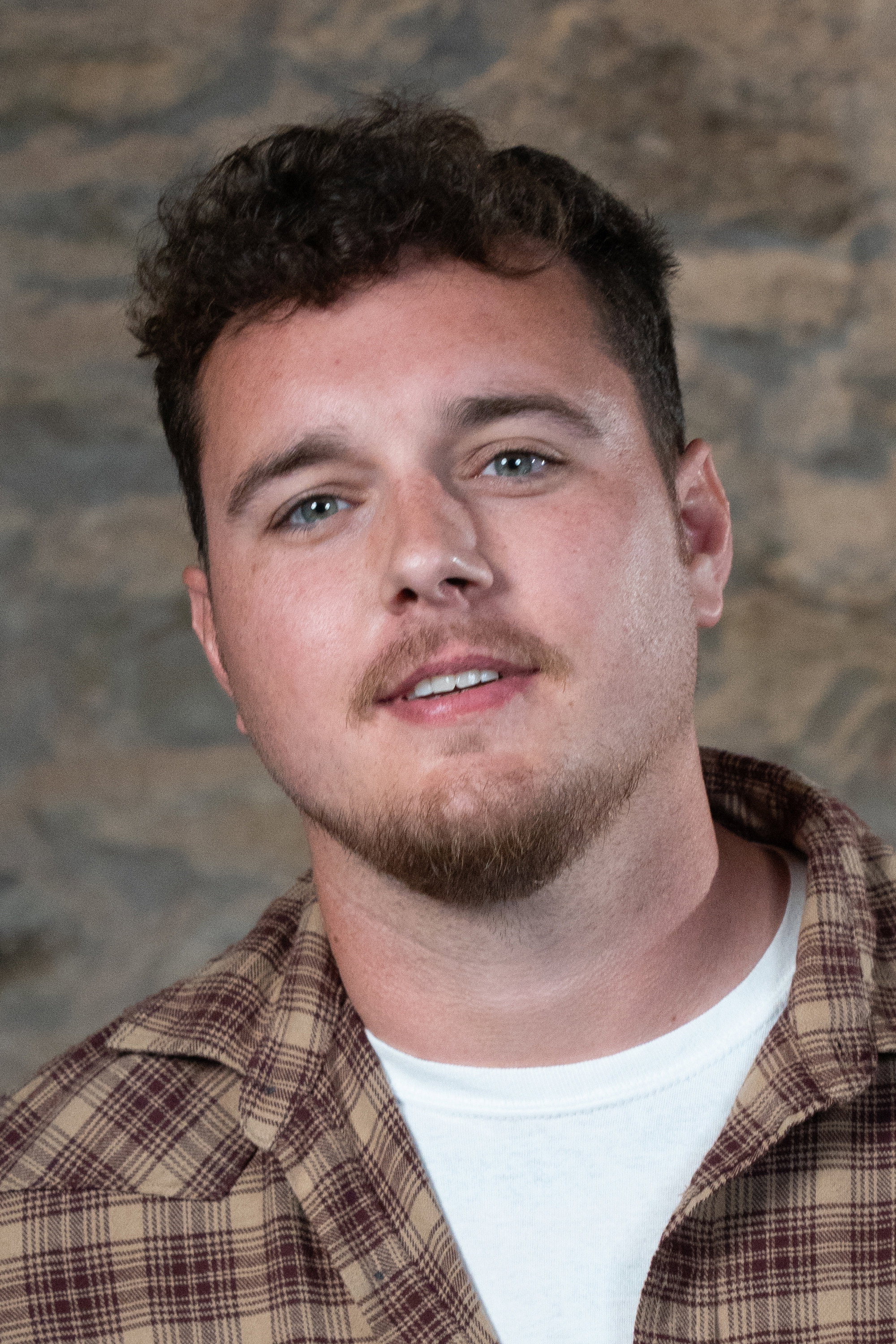 Mitchell Cole as Brook in Against the Spread